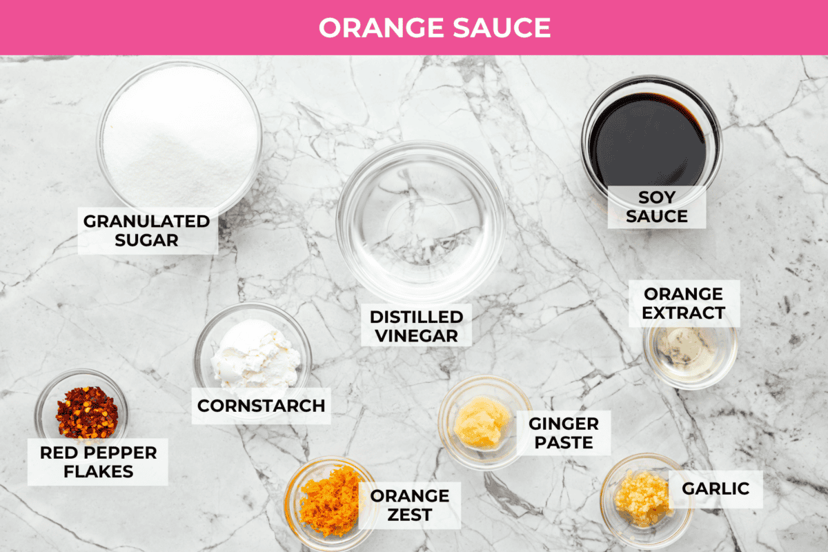 Overhead shot of labeled orange sauce ingredients. 