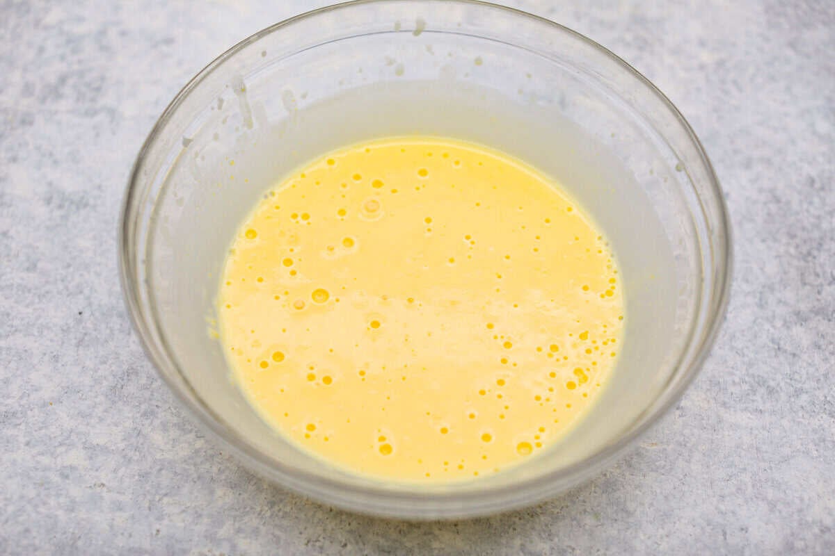 Orange creamsicle lush is sunshine in dessert form! With creamy orange layers, a buttery golden Oreo crust, and bright fresh citrus flavor, this easy no-bake dessert is a fun twist on my popular Lemon Lush that’s perfect for summer. Vanilla pudding and milk mixed together in a bowl.