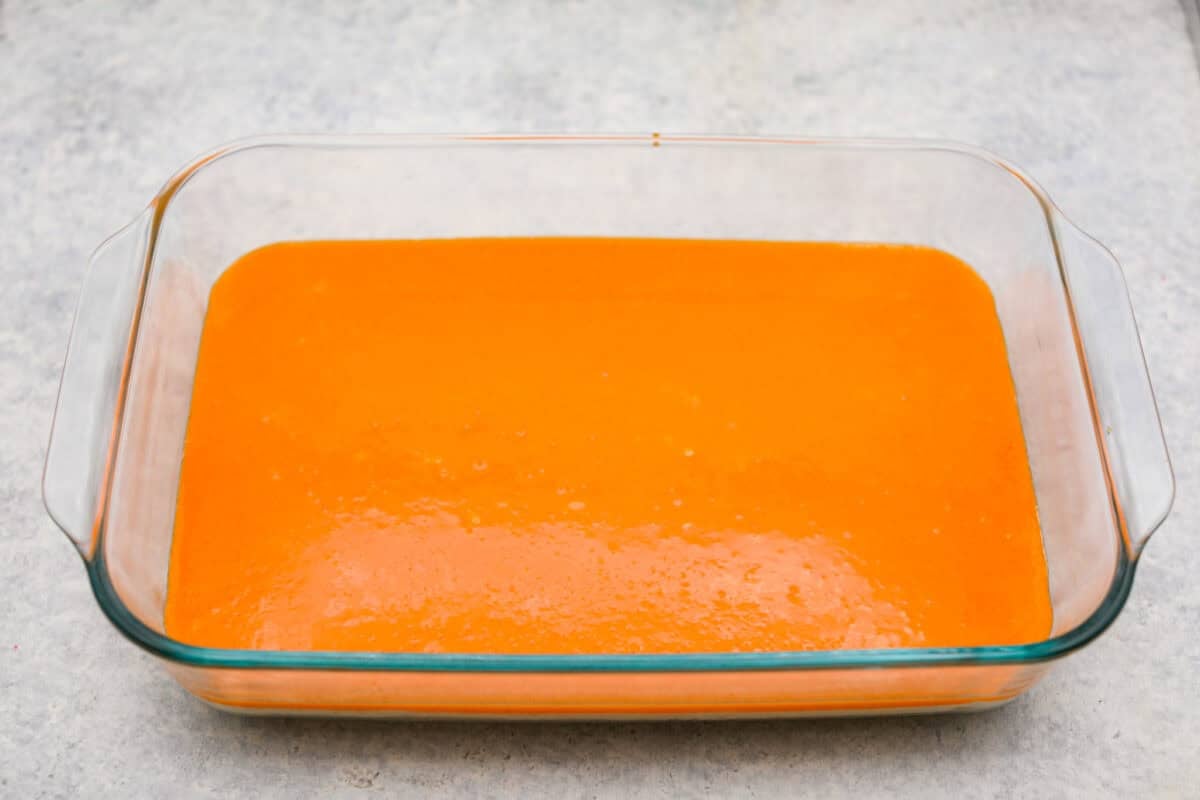 Orange creamsicle lush mixture on top of the cream cheese layer. 