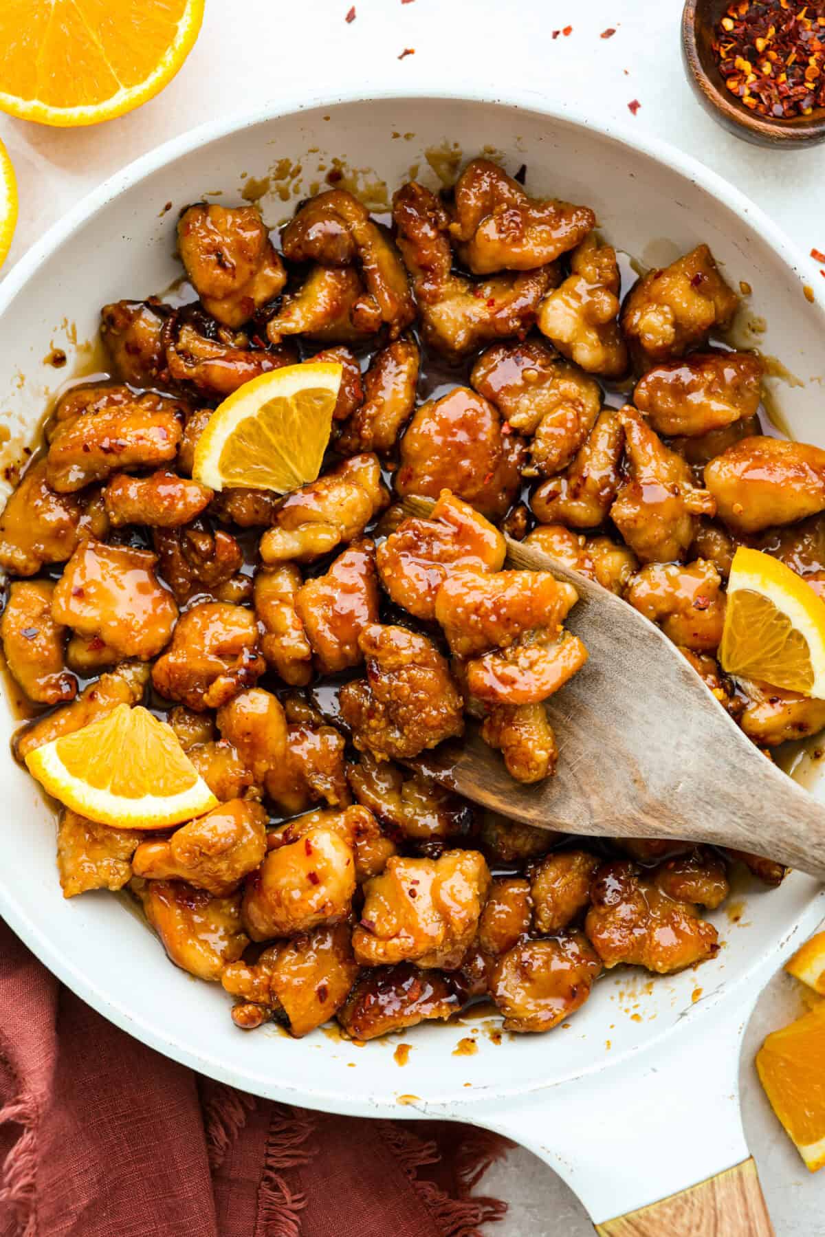 Overhead shot of Panda Express orange chicken in a skillet. 
