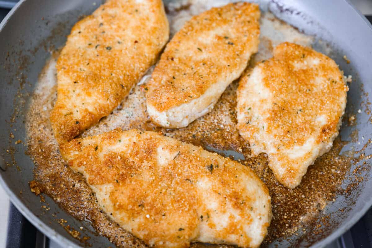 My family and I cannot get enough of this versatile summer vegetable! Whether you use it for a side dish or the entrรฉe, its tender texture and ability to absorb flavor is unmatched. Take advantage of zucchini being in season and try out some of my other favorite zucchini recipes! Chicken cooking in a skillet.