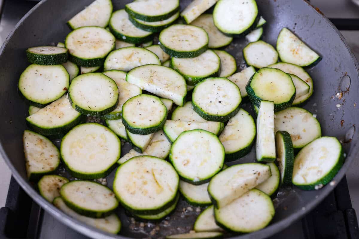 My family and I cannot get enough of this versatile summer vegetable! Whether you use it for a side dish or the entrรฉe, its tender texture and ability to absorb flavor is unmatched. Take advantage of zucchini being in season and try out some of my other favorite zucchini recipes! Zucchini sautรฉing in a skillet.