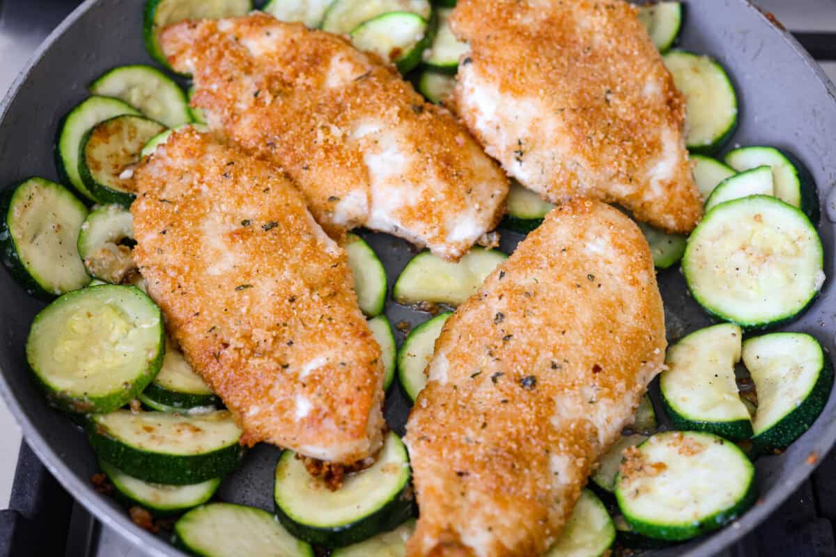My family and I cannot get enough of this versatile summer vegetable! Whether you use it for a side dish or the entrรฉe, its tender texture and ability to absorb flavor is unmatched. Take advantage of zucchini being in season and try out some of my other favorite zucchini recipes! Cooked chicken added back to the skillet.