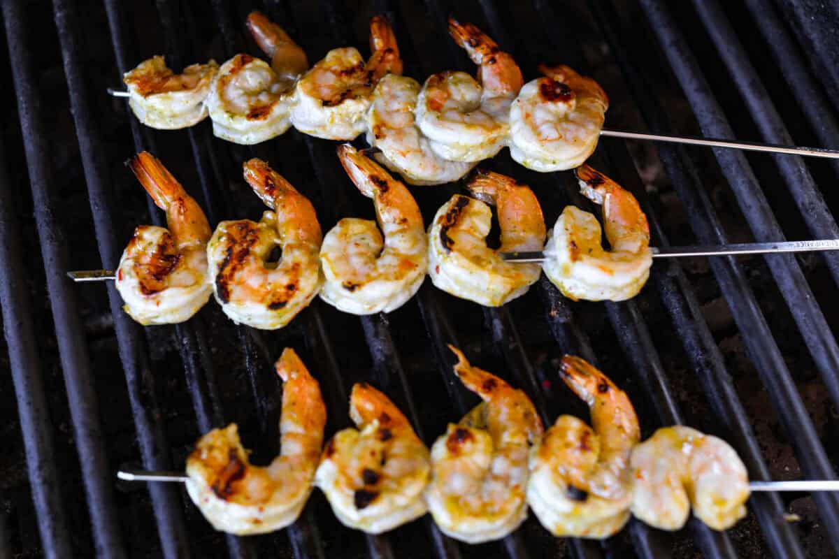 I love salads in the summer, and this grilled shrimp salad is such a good one. It’s fresh, colorful, and filling without feeling heavy. And the dressing? Oh my gosh. The chipotle-lime flavor is so good, you’ll want to pour it on everything. Shrimp skewers on the grill.