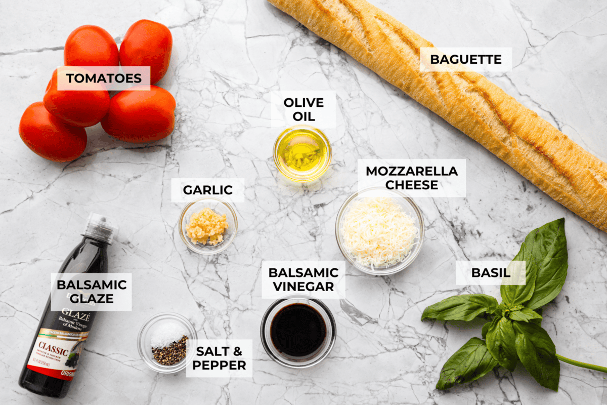 Iโve loved homegrown tomatoes since I was a kid, and this easy bruschetta recipe is one of my favorite ways to use them. The fresh basil, garlic, olive oil, and crispy toasted bread with that balsamic glaze make such a good flavor! Overhead shot of labeled bruschetta ingredients.