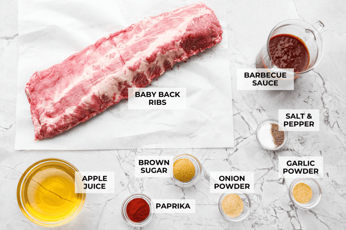 These grilled BBQ ribs are what summer cookouts are all about! Slow-cooked until fall-off-the-bone tender, then finished with a sticky, caramelized layer of BBQ sauce that'll have everyone licking their fingers. Overhead shot of labeled grilled bbq ribs ingredients.