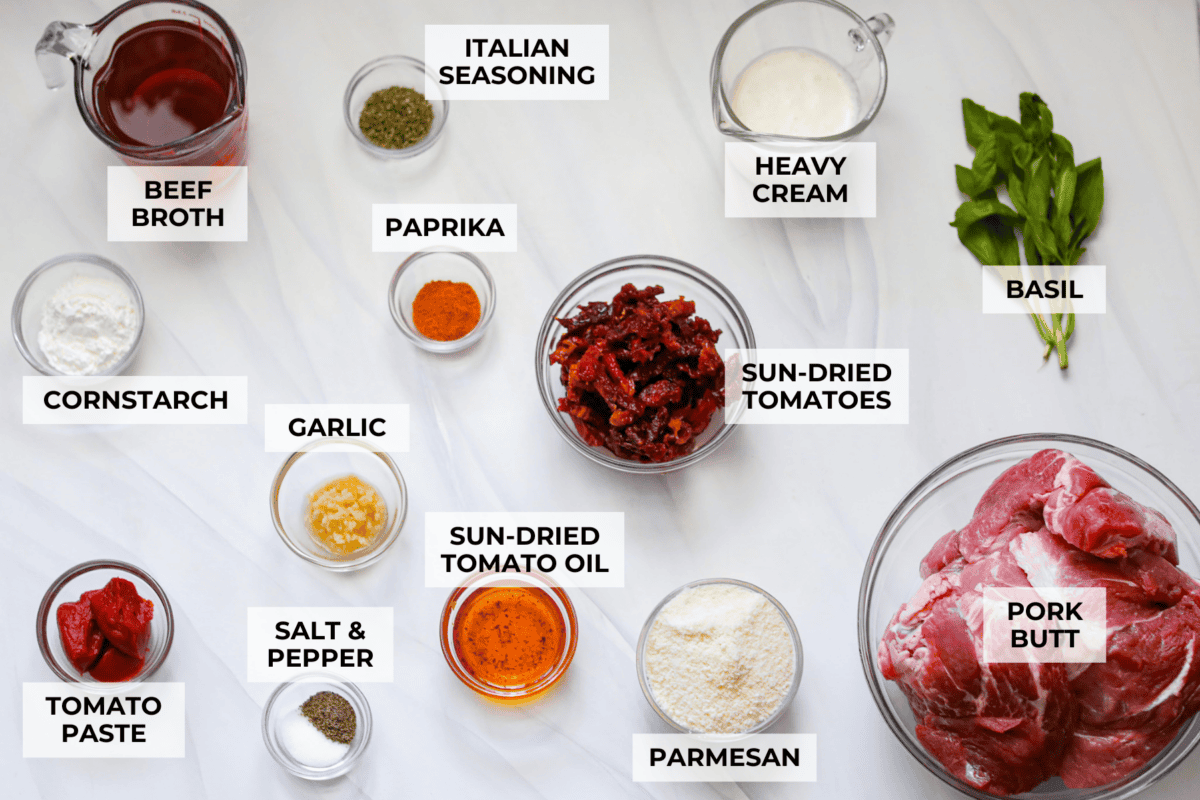 Marry Me Pork Roast lives up to its name! Tender pork, slow cooked in a creamy, garlicky sun-dried tomato sauce that's so good! Pile it over mashed potatoes or buttered noodles to soak up every drop. Overhead shot of labeled marry me pork roast ingredients.