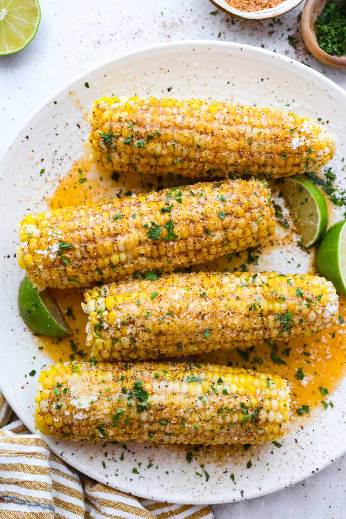 You already know I love a good corn recipe, and this Cajun corn on the cob is my new summer BBQ obsession. It takes sweet, juicy corn and gives it the buttery, spicy glow-up it deserves. Platter of Cajun corn on the cob.