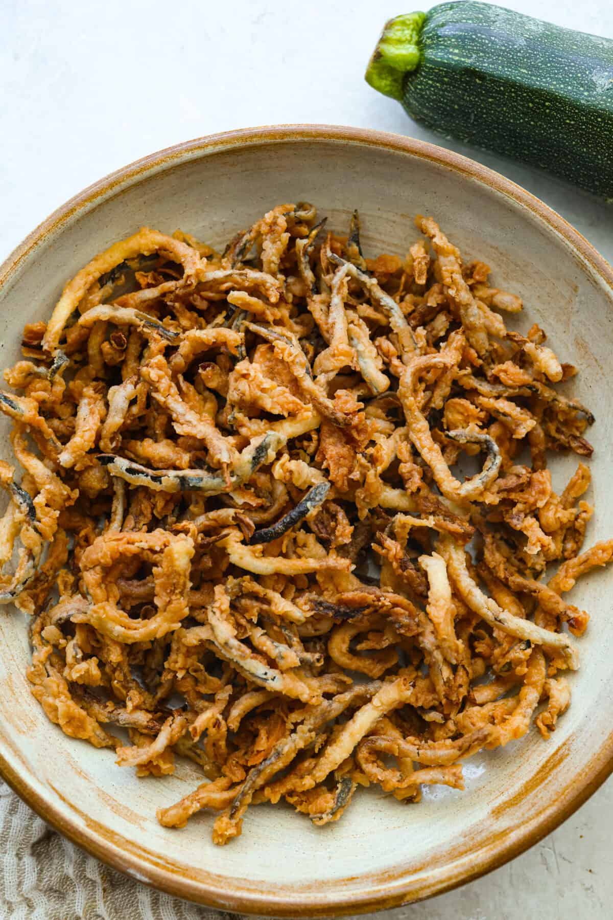 Bowl of crispy zucchini strings. 
