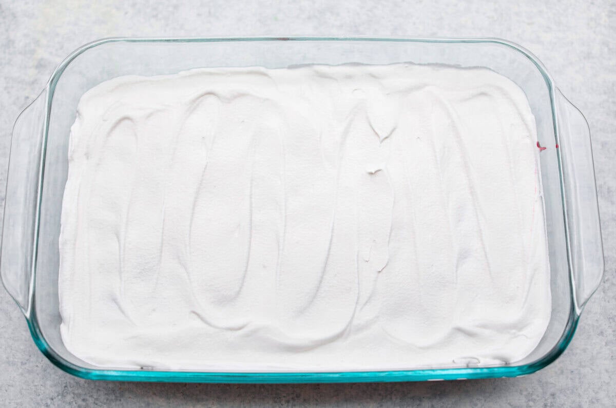 Whipped topping added to the top of the cherry pie filling. 
