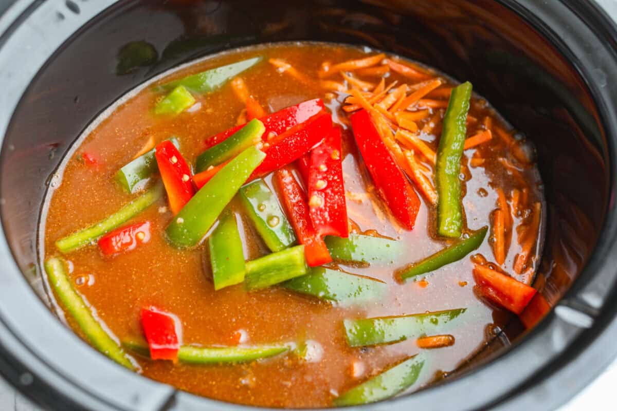 Slow cooker ramen gives you all the slurpy, saucy noodle bowl flavor with almost no effort. The veggies and beef slow cook in just an hour, then the ramen noodles go in for a quick 10 minutes. No hot oven, no boiling pots! Broth added to the crock pot.