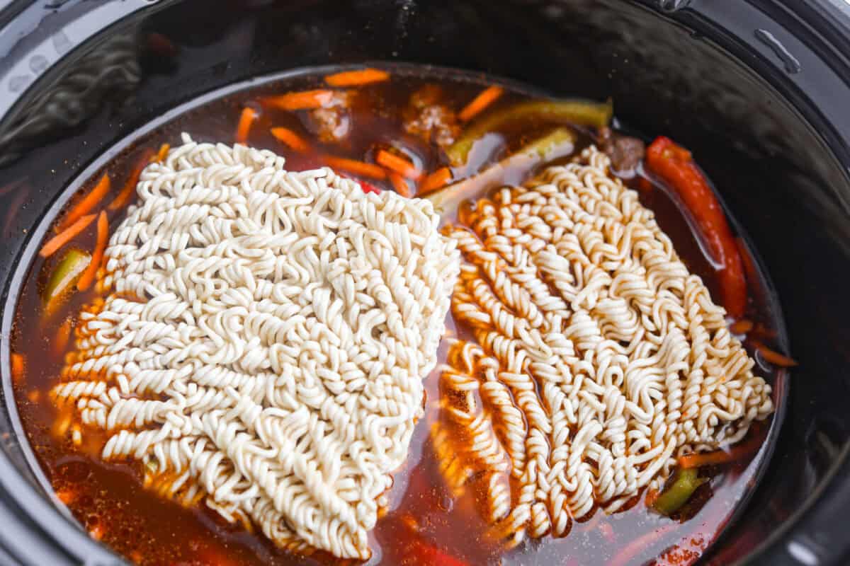 Slow cooker ramen gives you all the slurpy, saucy noodle bowl flavor with almost no effort. The veggies and beef slow cook in just an hour, then the ramen noodles go in for a quick 10 minutes. No hot oven, no boiling pots! Noodles added to the crock pot.