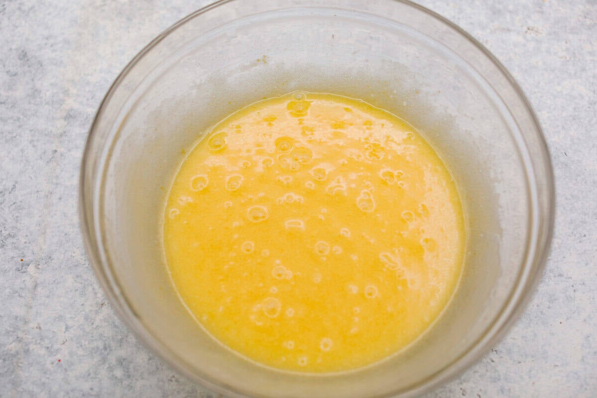 Wet ingredients combined in a mixing bowl. 