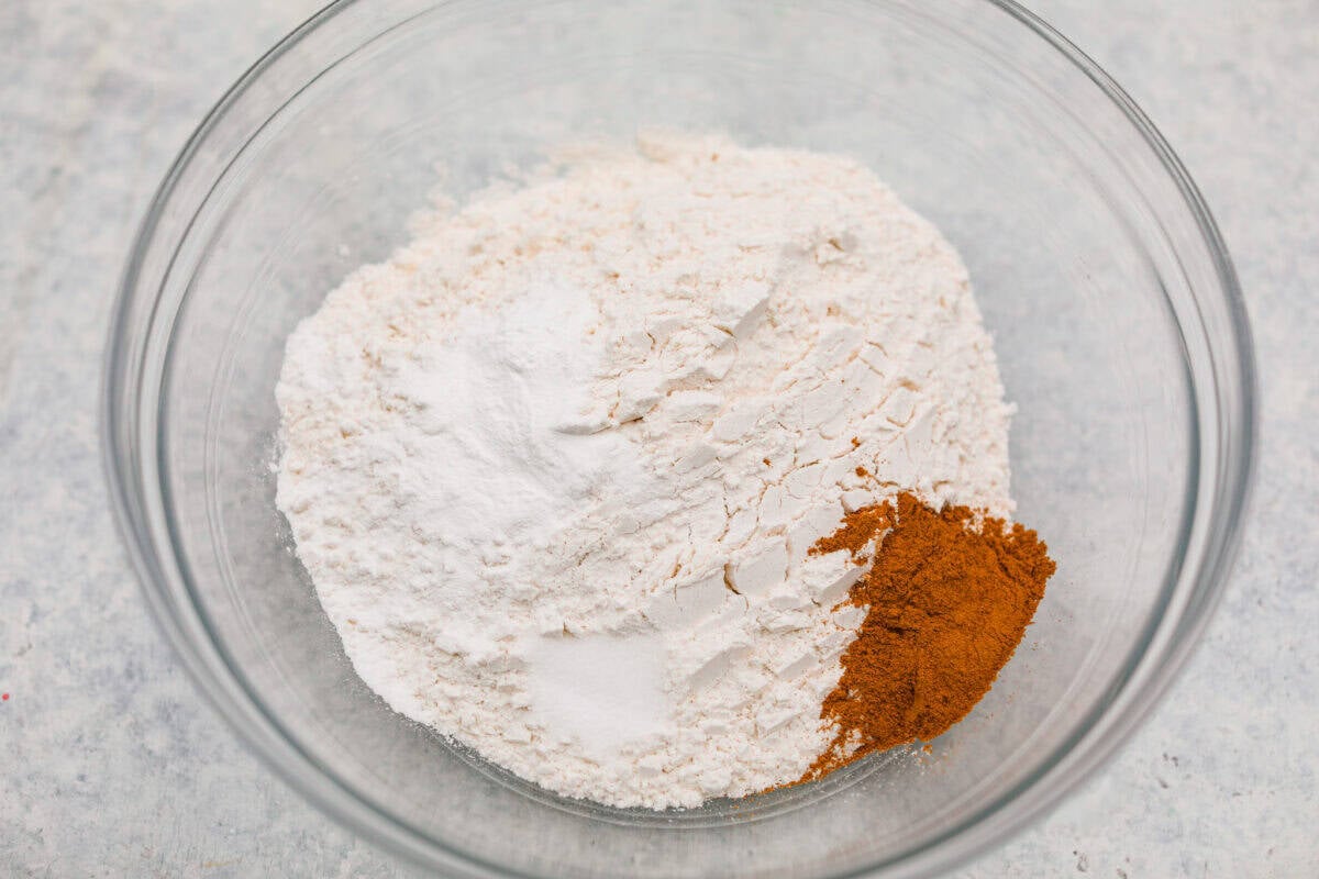 Dry ingredients added to a mixing bowl. 