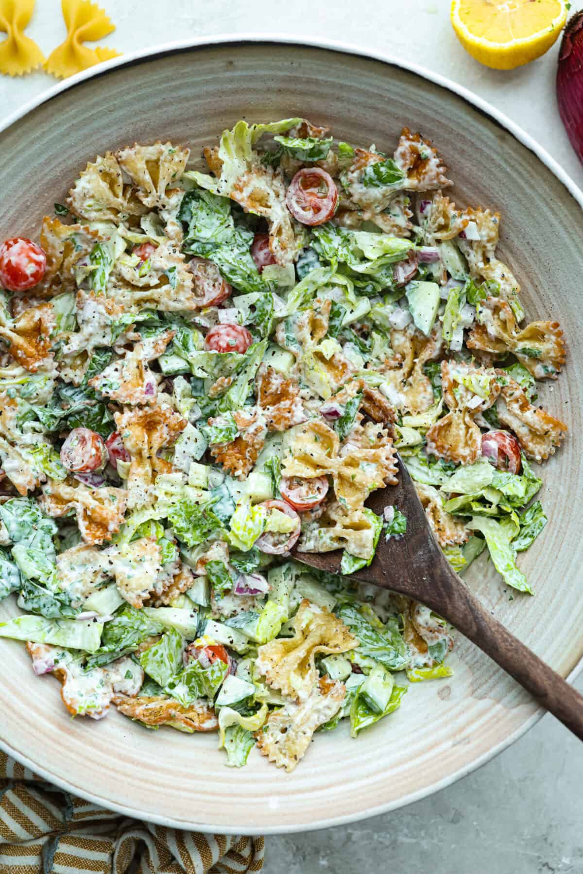 The viral crispy pasta salad trend is here, and it’s easy to see what the hype is about! Golden, crunchy pasta is tossed with fresh veggies and a creamy dressing for a fun upgrade that’s anything but boring. Large bowl of crispy pasta salad.