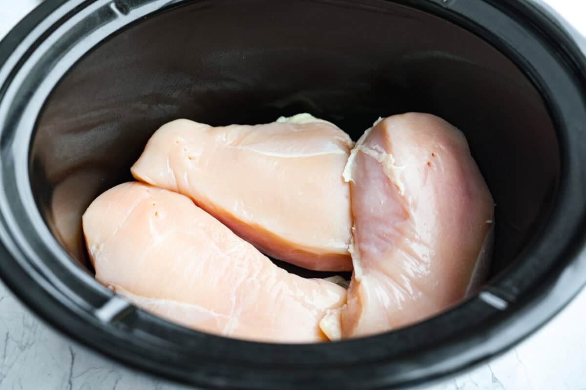 Slow cooker Aloha chicken is sweet, smoky, and so easy to throw together! Tender chicken cooks with pineapple, onion, and barbecue sauce until itβs full of flavor and ready to shred. Serve it over rice for a simple dinner the whole family will love. Slow cooker with chicken breasts added.