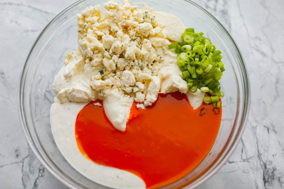 Sauce ingredients added to a bowl. 