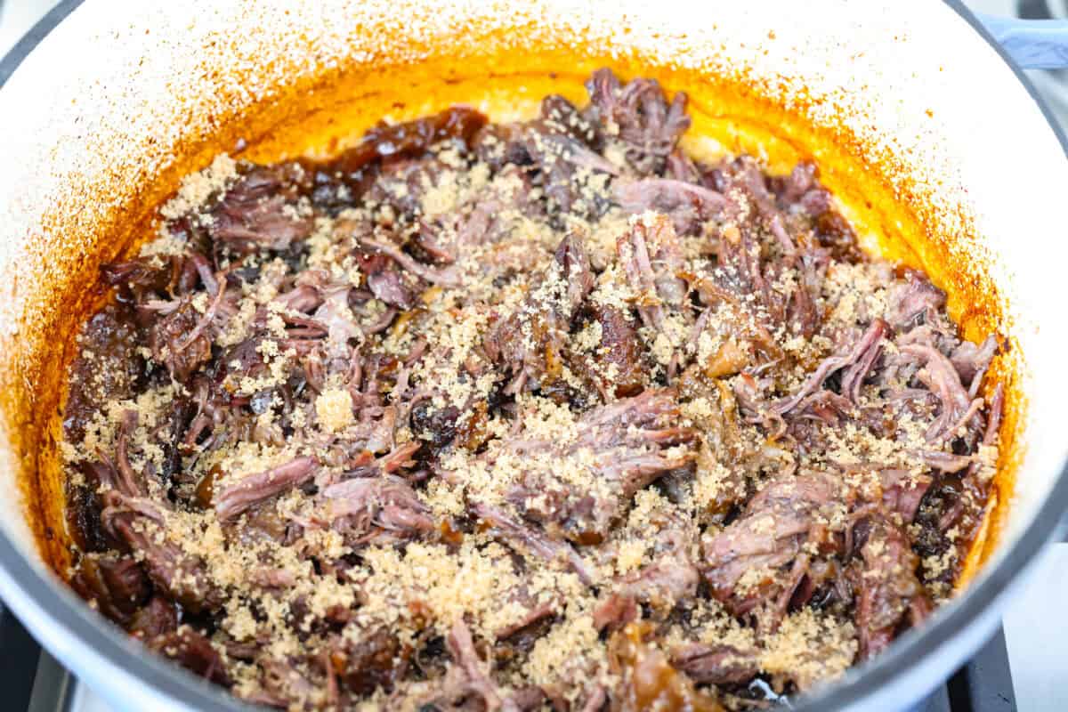 Caramelized chuck roast is everything I want in a cozy dinner. The beef cooks low and slow until it practically falls apart, then gets sprinkled with brown sugar and broiled until the edges are sticky, caramelized, and SO good. Beef shredded and brown sugar added to the top.