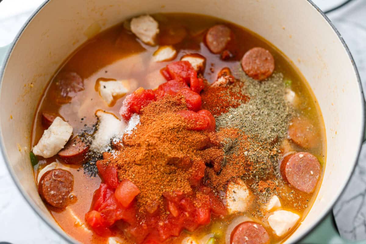 Tomato past, chicken broth and seasonings added to the pot. 