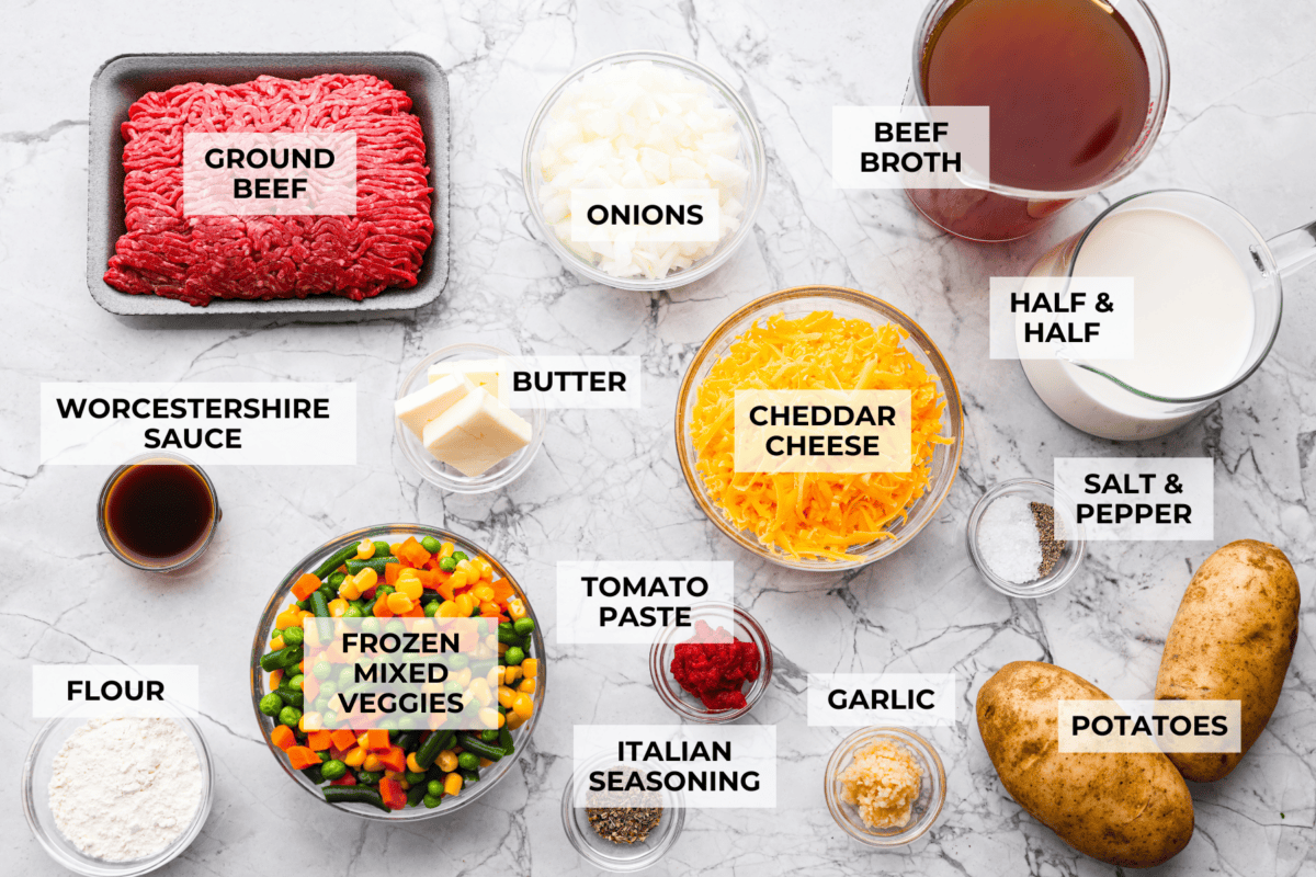 Shepherd’s pie soup has all the cozy, comforting flavors of classic shepherd’s pie in one hearty bowl! Think savory beef, tender potatoes, vegetables, and melted cheddar in a rich, creamy broth. It’s classic comfort food with a fun twist! Overhead shot of labeled shepherd's pie soup ingredients.