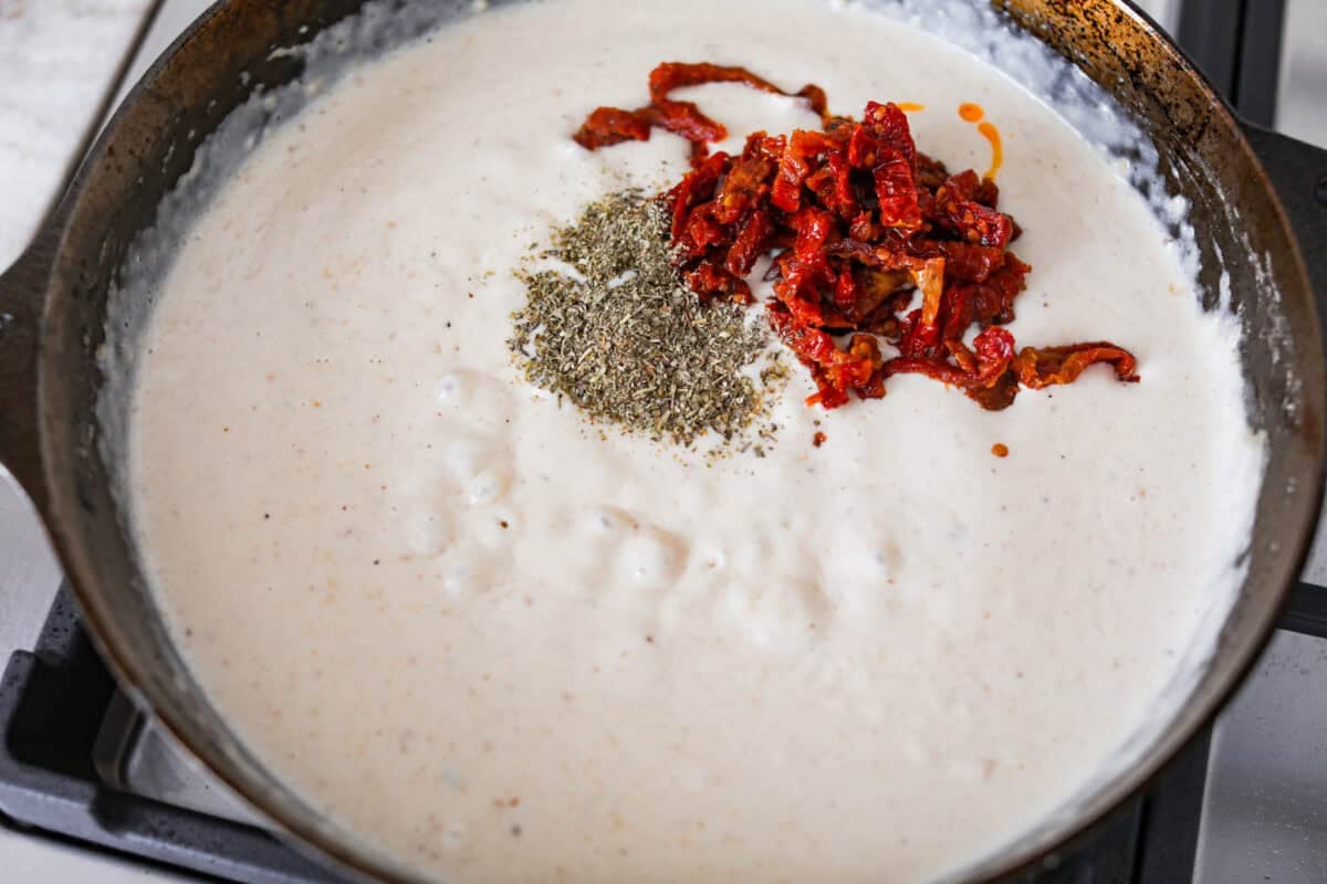 Chicken broth, cream, sun-dried tomatoes and seasonings added to the butter and flour mixture. 