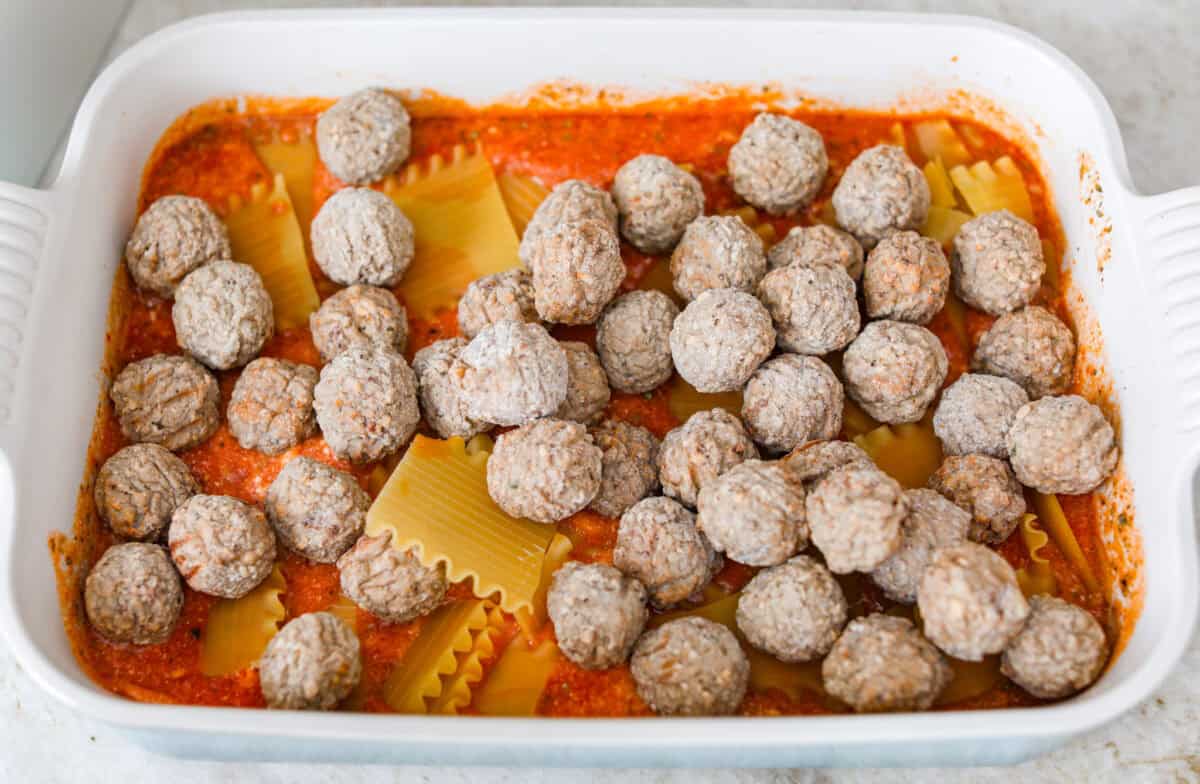 Meatballs added to the top of the noodle pieces. 