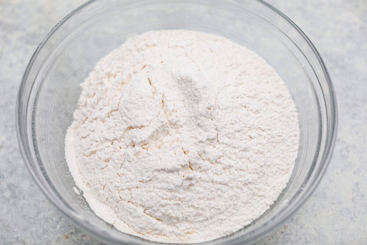 Jacques Torres Chocolate Chip Cookies come from the famous “Mr. Chocolate” himself. They were featured in The New York Times’ search for the perfect chocolate chip cookie. The secret is letting the dough rest before baking. It gives you crisp, buttery edges and chewy centers. Dry ingredients added to the bowl.