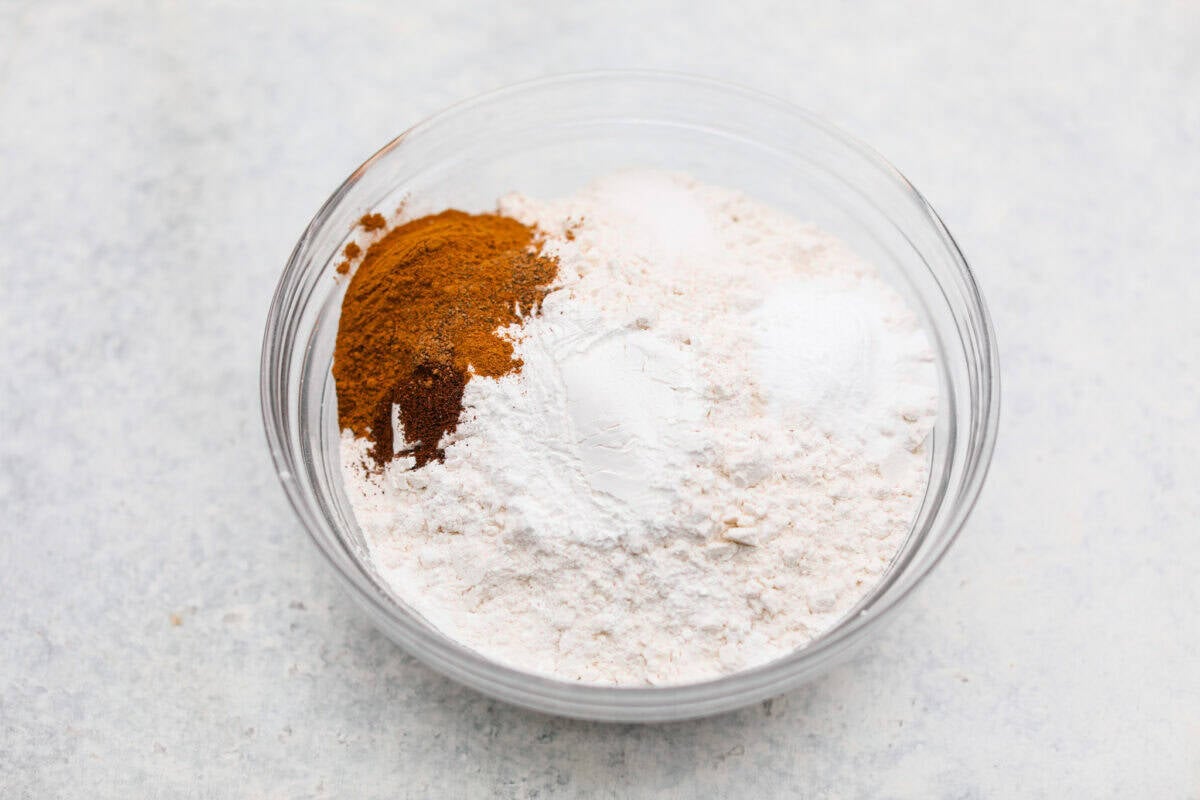 Dry ingredients added to a bowl. 