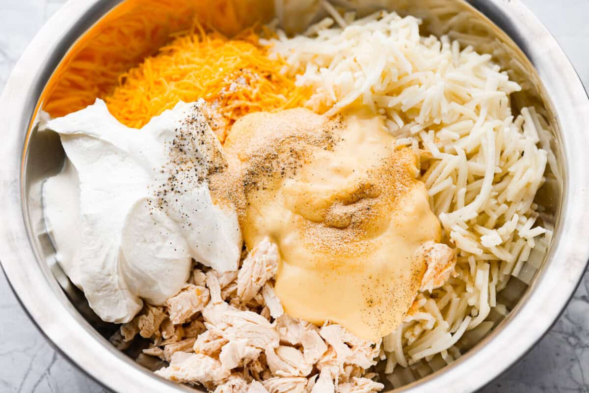 Casserole ingredients added to a mixing bowl. 