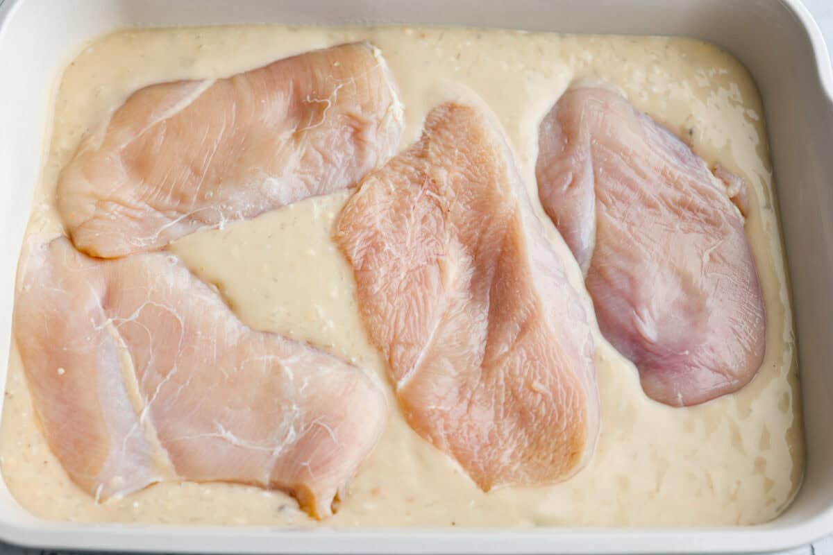 chicken and rice casserole could not be easier Chicken breasts added over the top of the sauce then seasoned.