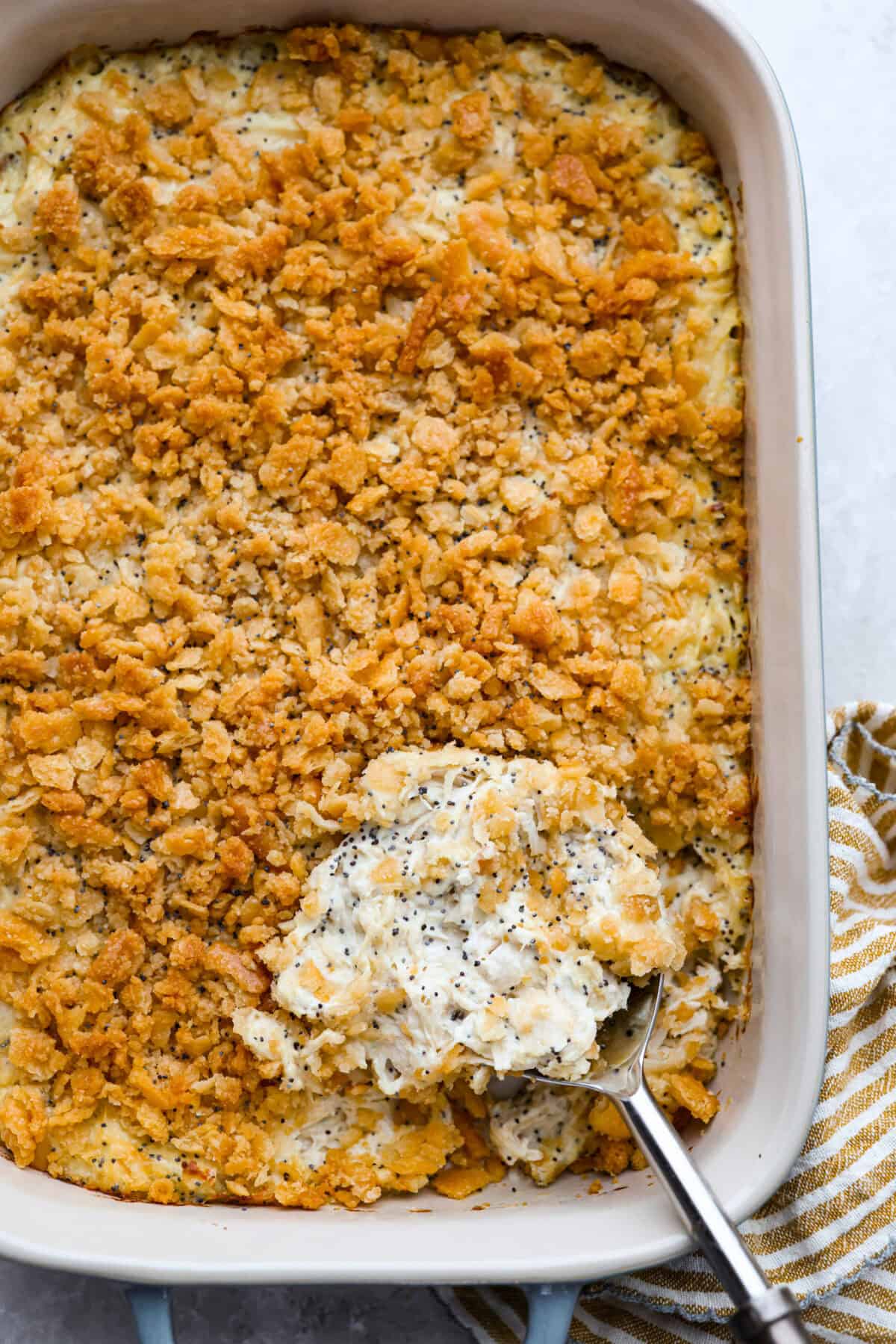Poppy seed chicken casserole is creamy, cozy, and so easy to make! Tender chicken is topped with buttery Ritz crackers for the perfect crunch, and it’s ready in just 35 minutes. Poppy seed chicken casserole.