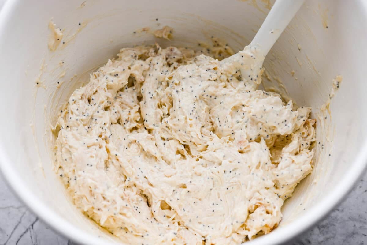 Poppy seed chicken casserole is creamy, cozy, and so easy to make! Tender chicken is topped with buttery Ritz crackers for the perfect crunch, and it’s ready in just 35 minutes. Ingredients all mixed together.