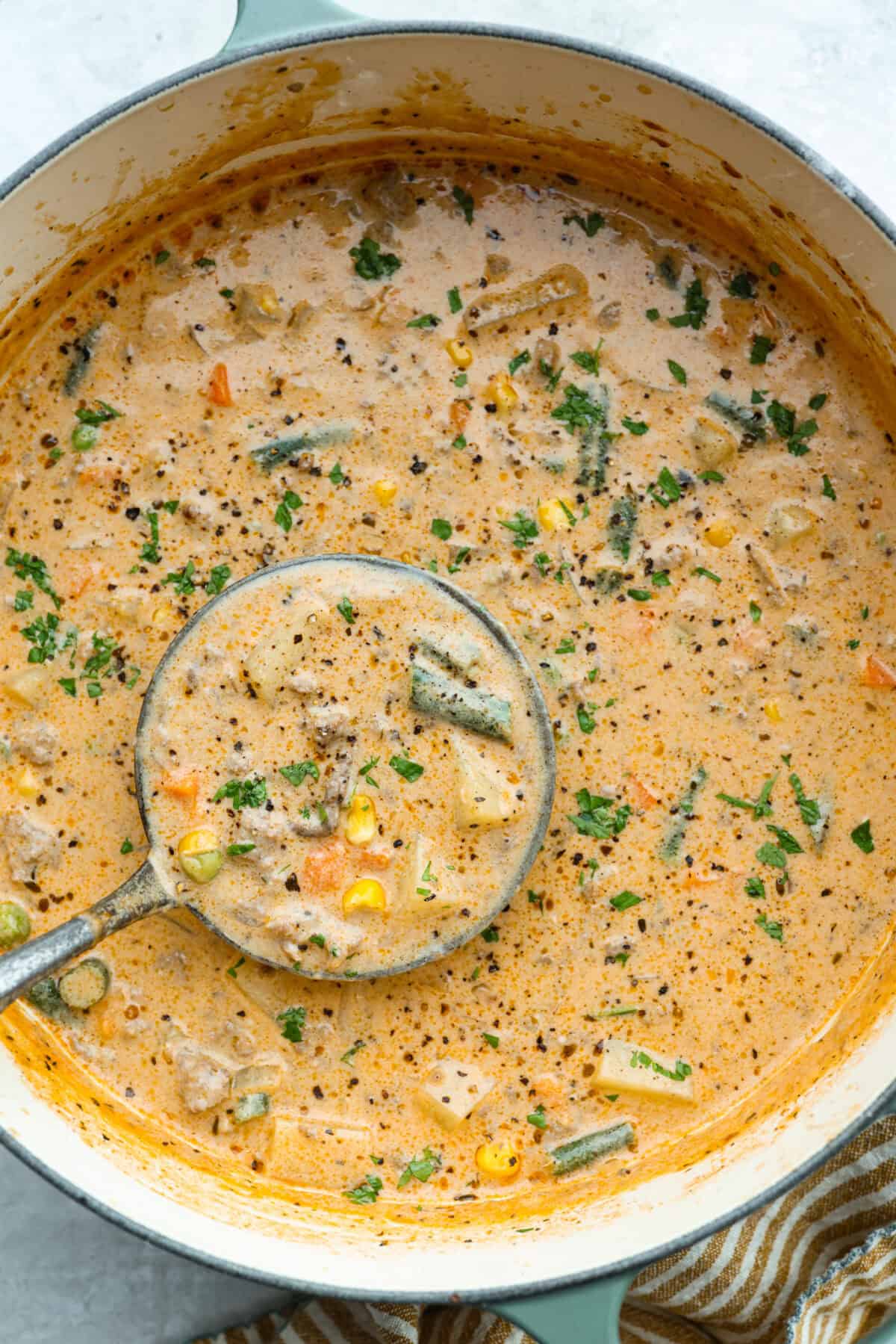 Shepherd’s pie soup has all the cozy, comforting flavors of classic shepherd’s pie in one hearty bowl! Think savory beef, tender potatoes, vegetables, and melted cheddar in a rich, creamy broth. It’s classic comfort food with a fun twist! Post of Shepherd's pie soup with a ladle.