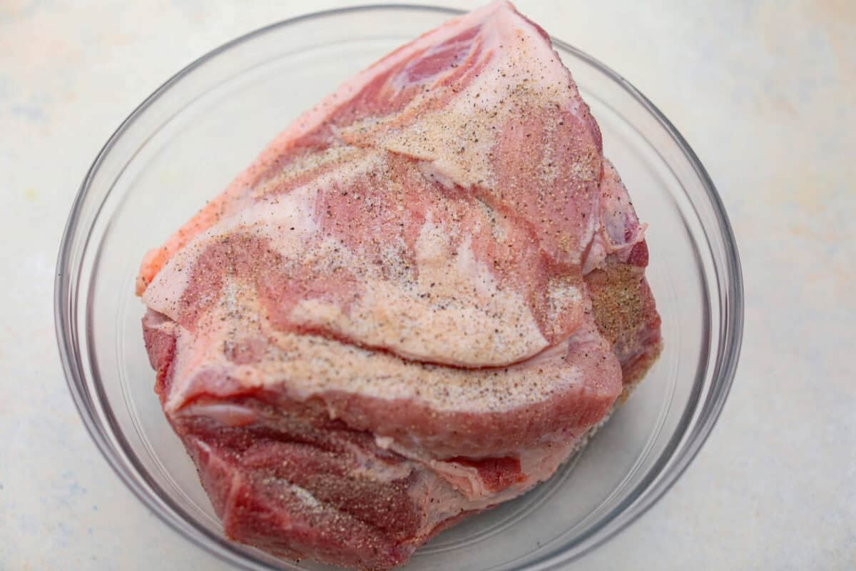 If you love a good Sunday roast, this apple cider pork roast needs to be on your fall menu. Tender pork cooks with apple cider, herbs, and sweet-tart apples until it’s fall-apart tender and perfect over creamy mashed potatoes. Pork roast seasoned with salt and pepper.