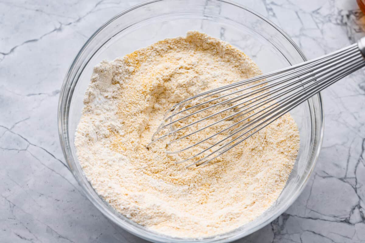 Dry ingredients whisked together in a mixing bowl. 