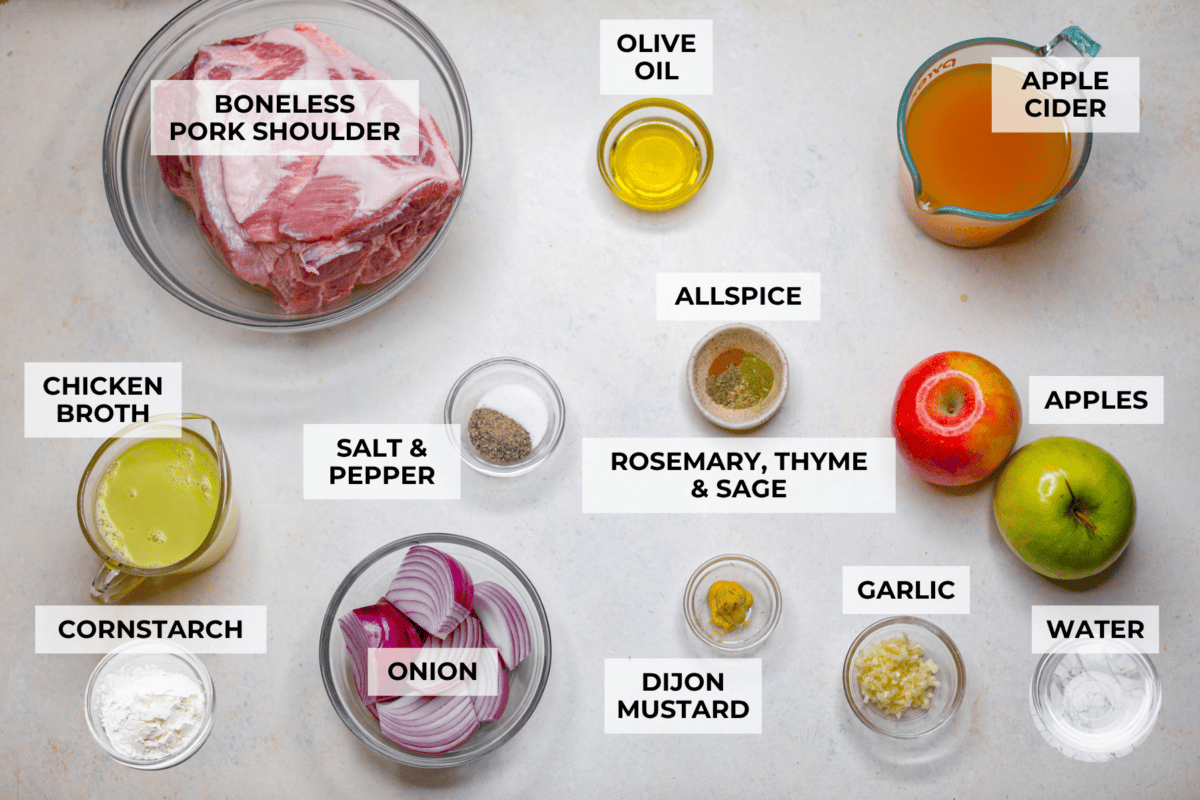 If you love a good Sunday roast, this apple cider pork roast needs to be on your fall menu. Tender pork cooks with apple cider, herbs, and sweet-tart apples until it’s fall-apart tender and perfect over creamy mashed potatoes. Overhead shot of labeled ingredients.
