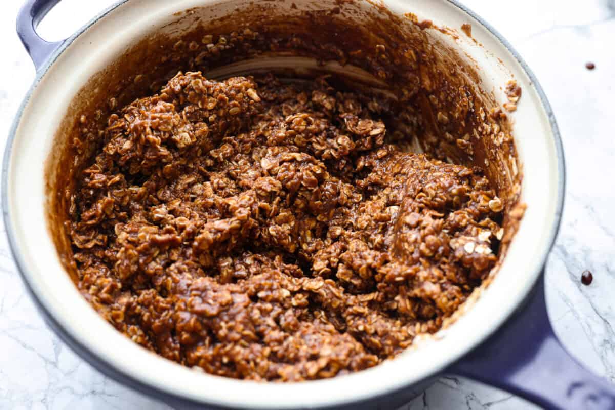 These classic no bake cookies are loaded with chocolate, creamy peanut butter, and chewy oats. They come together in just minutes on the stovetop, and you don’t even have to turn on the oven! Oats added to the chocolate mixture.