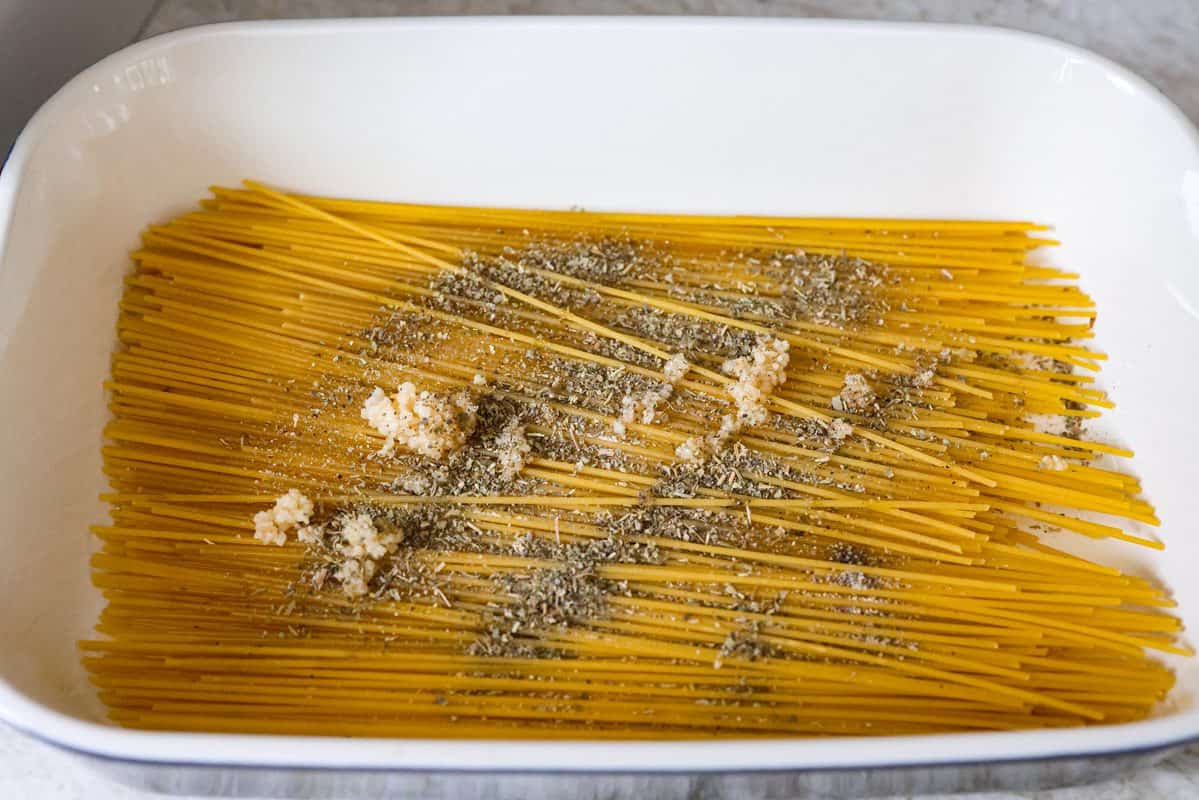Spaghetti, seasonings in the bottom of the baking dish. 