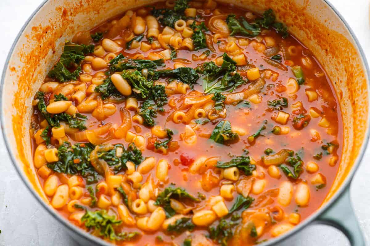 I had to try Stanley Tucci’s pasta fagioli, and his shortcut is so smart! He uses marinara sauce to add tons of flavor without a long list of ingredients. Add creamy beans, tender pasta, kale, and Parmesan, and you have a cozy dinner in just 35 minutes. Kale and lemon juice added to the pot, then seasoned with salt and pepper to taste.