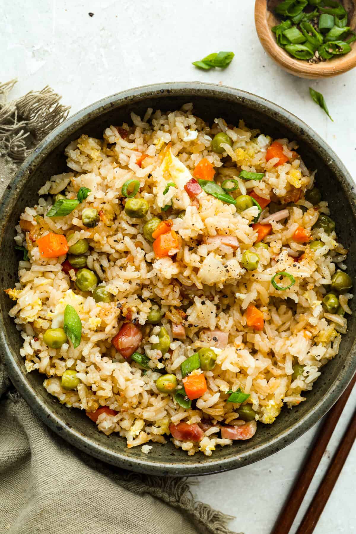 I LOVE fried rice, and my classic fried rice is already so easy, but I’m obsessed with this baked version! Dump everything into one baking dish, pop it in the oven, and dinner is served. It has all that savory fried rice flavor with less work! Serving portion of baked fried rice.