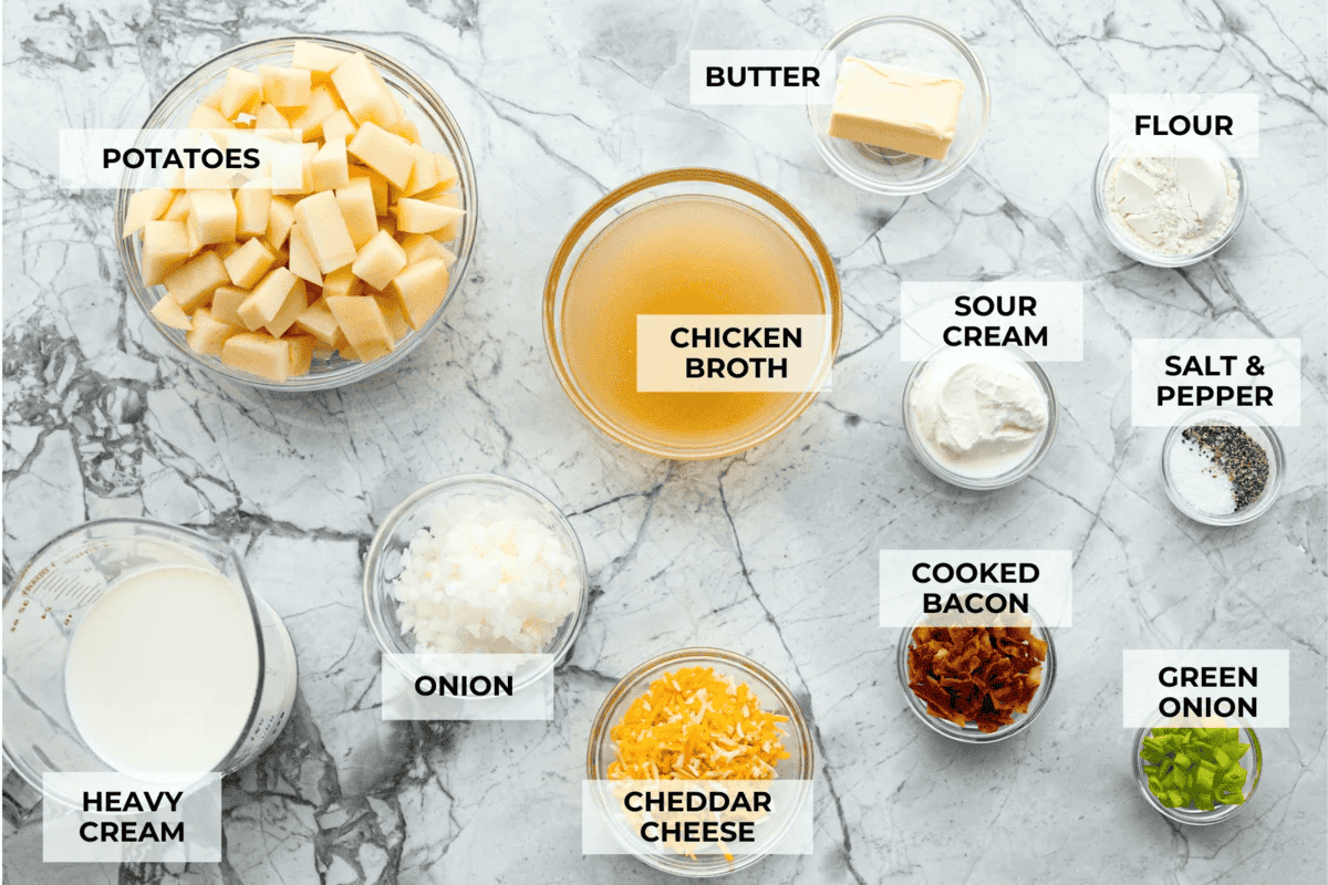 This slow cooker loaded baked potato soup is thick, creamy, and packed with tender potatoes. Top each bowl with crispy bacon, shredded cheese, and green onions for all the flavor of a loaded baked potato in one cozy bowl. Overhead shot of labeled slow cooker loaded baked potato soup ingredients.