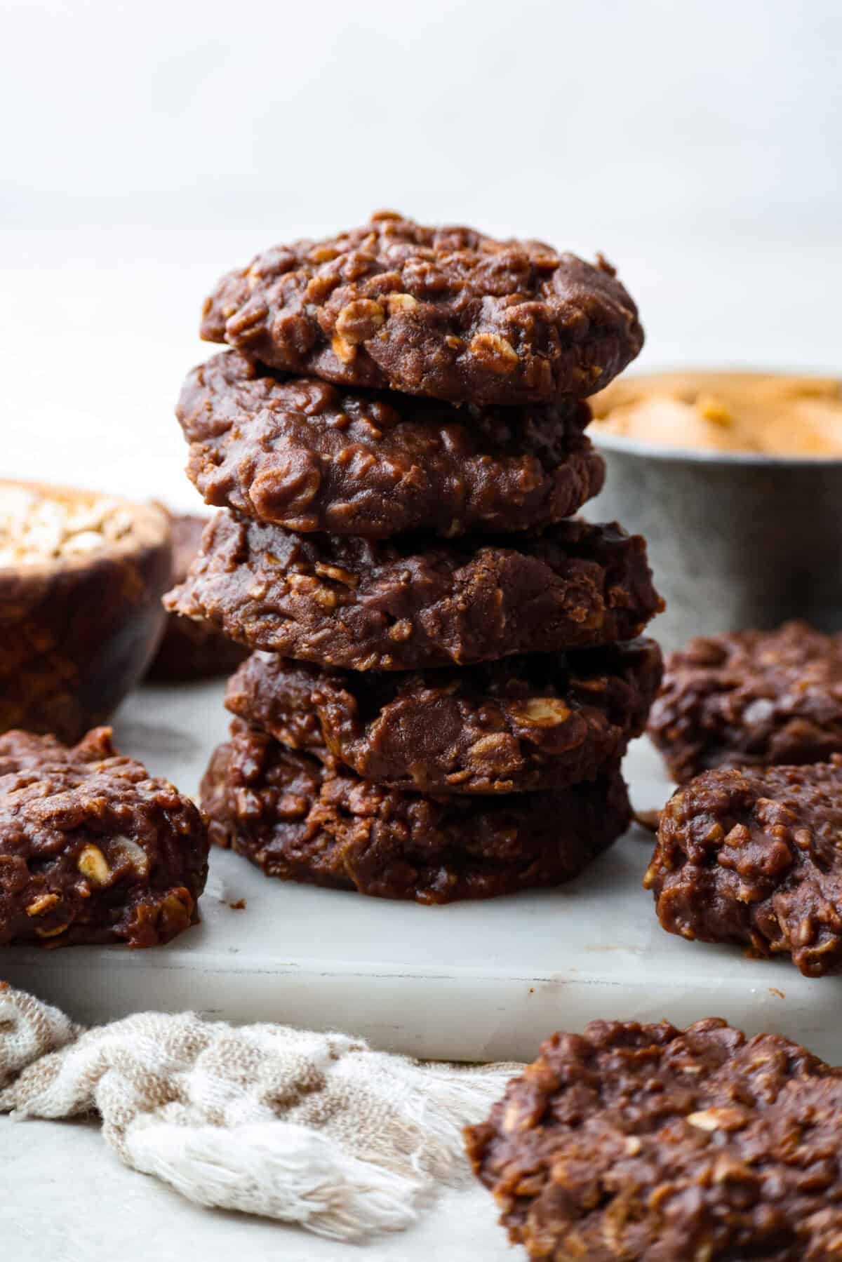 These classic no bake cookies are loaded with chocolate, creamy peanut butter, and chewy oats. They come together in just minutes on the stovetop, and you don’t even have to turn on the oven! Stack of no bake cookies.