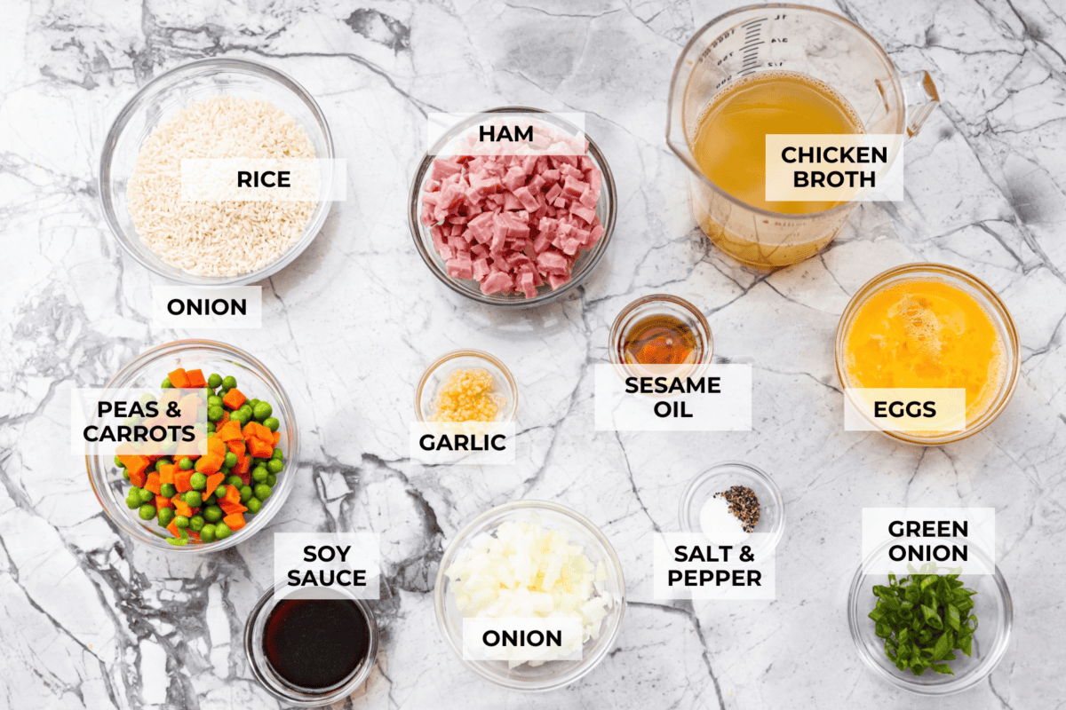 I LOVE fried rice, and my classic fried rice is already so easy, but I’m obsessed with this baked version! Dump everything into one baking dish, pop it in the oven, and dinner is served. It has all that savory fried rice flavor with less work! Overhead shot of labeled baked fried rice ingredients.