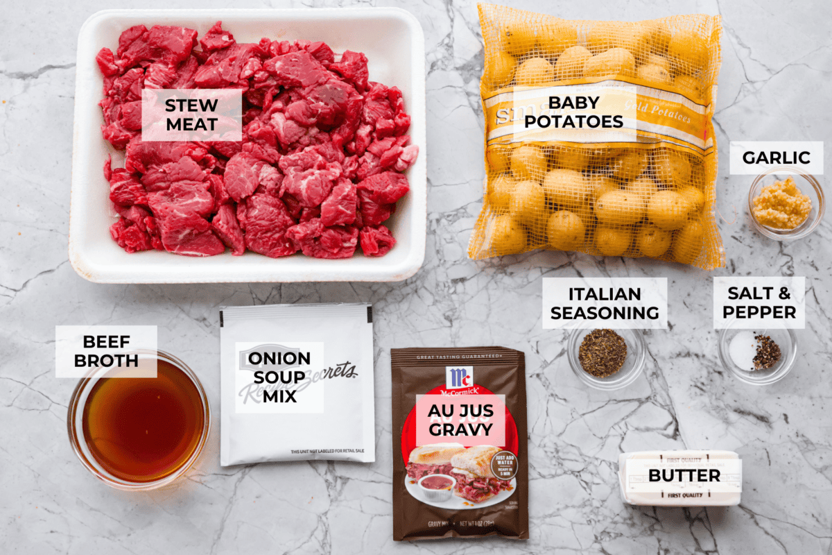 Steak and potatoes are always a good idea, but when the slow cooker does all the work? Even better! This Slow Cooker Steak and Potatoes has melt in your mouth beef, tender, buttery potatoes. And don't even get me started on the delicious savory gravy! Overhead shot of labeled slow cooker steak and potatoes ingredients.