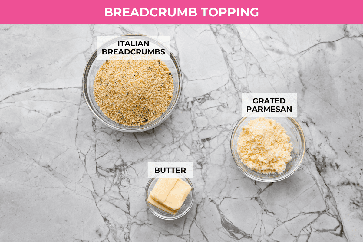 Craving chicken parm? Grab a spoon! This chicken parmesan soup is loaded with tender chicken, pasta, and a rich, creamy tomato broth. Finish with crispy, buttery breadcrumbs for a delicious twist on the Italian classic! Overhead shot of labeled breadcrumb topping ingredients.