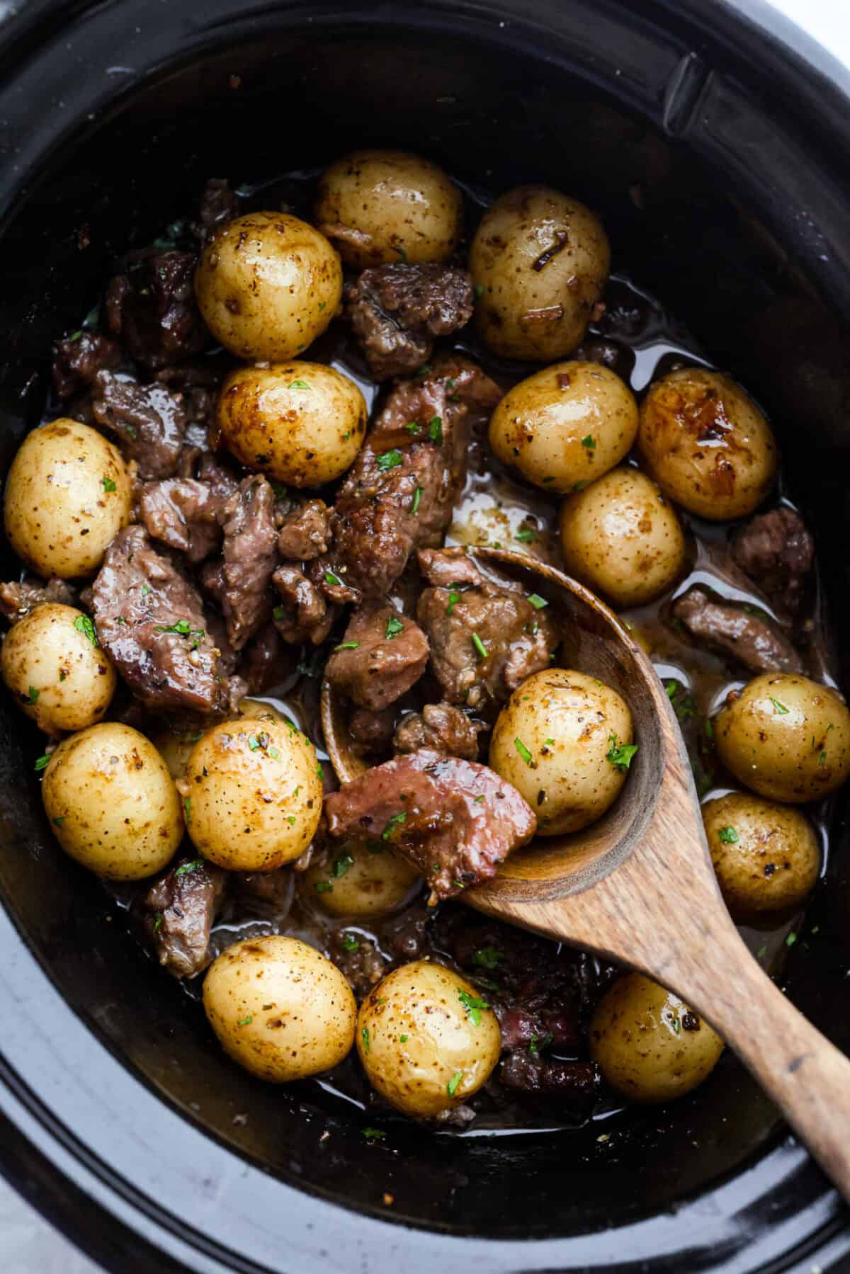 Steak and potatoes are always a good idea, but when the slow cooker does all the work? Even better! This Slow Cooker Steak and Potatoes has melt in your mouth beef, tender, buttery potatoes. And don't even get me started on the delicious savory gravy! Slow cooker full of tender steak and potatoes smothered in a savory gravy sauce.