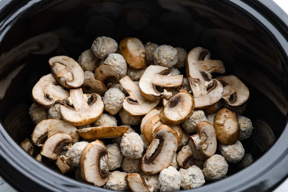 Slow cooker Salisbury steak meatballs are the ultimate comfort food! Tender meatballs and mushrooms simmer in a rich, savory gravy, and the best part? You only need 5 minutes of prep! Frozen meatballs and mushrooms added to the slow cooker.