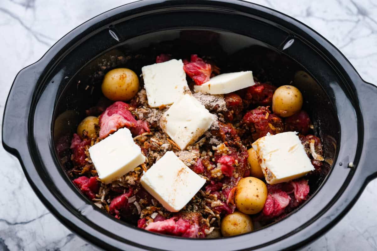 Steak and potatoes are always a good idea, but when the crockpot does all the work? Even better! This Slow Cooker Steak and Potatoes has melt in your mouth beef, tender, buttery potatoes. And don't even get me started on the delicious savory gravy! Slow cooker with meat, potatoes, seasoning packets, broth, and butter.